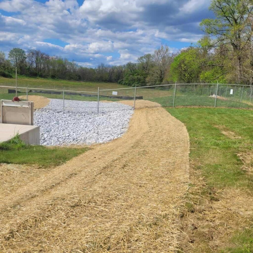 freshly mowed grass and new gravel rocks after SES site contractor services